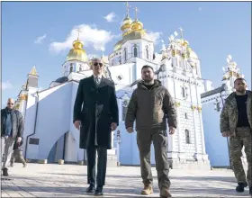  ?? EVAN VUCCI — THE ASSOCIATED PRESS FILE ?? U.S. President Joe Biden walks with Ukrainian President Volodymyr Zelenskyy in Kyiv, Ukraine, Monday, Feb. 20, 2023. As chances rise of a Biden-donald Trump rematch in the U.S. presidenti­al election race, America’s allies are bracing for a bumpy ride, with concerns rising that the U.S. could grow less dependable regardless of who wins.