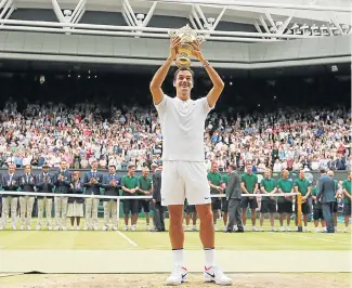  ?? /Reuters ?? Roger that: Roger Federer savours his historic victory over Marin Cilic.