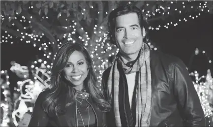  ??  ?? Taniya Nayak and Carter Oosterhous­e host “The Great Christmas Light Fight”