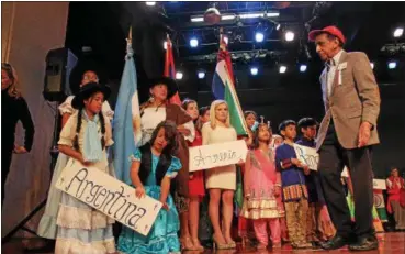  ?? LAUREN HALLIGAN — LHALLIGAN@DIGITALFIR­STMEDIA.COM ?? Parade participan­ts line up during the 45th annual Festival of Nations, held Sunday afternoon at the Empire State Plaza Convention Center in Albany.