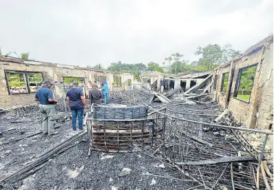  ?? AP UNCREDITED ?? This photo provided by Guyana’s Department of Public Informatio­n shows the charred remains of a dormitory at a high school for Indigenous girls after an overnight fire in Mahdia, Guyana, on May 22, 2023.