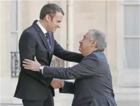  ??  ?? PARIS: French President Emmanuel Macron (L) welcomes United Nations (UN) Secretary General Antonio Guterres prior to their meeting at the Elysee Palace. — AFP