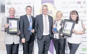  ?? Liz Hall ?? Hyndburn MP with some of last year’s Business Awards winners – Small Business joint winners Bevlan Office Interiors and Whewells of Accrington