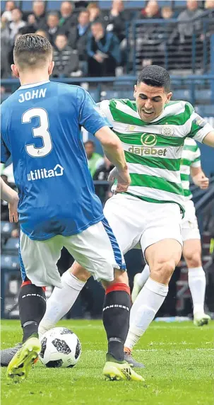  ??  ?? Tom Rogic puts Celtic ahead against Rangers at Hampden.