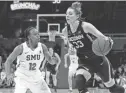  ?? RAY CARLIN/USA TODAY SPORTS ?? Connecticu­t’s Katie Lou Samuelson dribbles around SMU’s Morgan Bolton on Saturday.