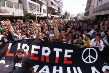  ?? — AFP file photo ?? Tens of thousands of ethnic Berbers mark the 22nd anniversar­y of the brutal crackdown on the protests of ‘Berber Spring’ at Beni Douala in Algeria’s Kabylie region. Twenty years ago, the death of an Algerian teenager in police custody in Kabylie, homeland of the country’s Berber minority, sparked an uprising that helped blaze the trail for future protests in the North African country.