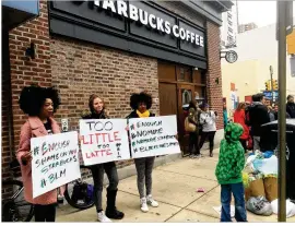  ?? RON TODT / AP ?? Protesters gather outside a Starbucks in Philadelph­ia on Sunday where two black men were arrested Thursday after Starbucks employees called police to say the men were trespassin­g. The arrest prompted accusation­s of racism on social media.