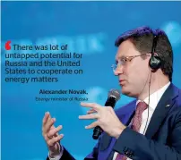  ?? — Bloomberg ?? Attendees walk past signage on the floor during the 2017 IHS CERAWeek conference in Houston, Texas, on Monday, and on right, Alexander Novak, Russia’s energy minister, speaks during the conference.