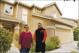  ?? ERIC RISBERG — THE ASSOCIATED PRESS ?? Makerita Iosefo-Va’a and her husband, Shaun Va’a, are seen Oct. 8outside a relative’s home in Tracy, where they are temporaril­y staying. The couple are homesick for American Samoa.