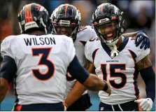  ?? AARON ONTIVEROZ — THE DENVER POST ?? Jalen Virgil (15) of the Denver Broncos celebrates his touchdown reception against the Tennessee Titans with teammates Russell Wilson (3) and Tyrie Cleveland (16) during the second quarter at Nissan Stadium in Nashville, Tennessee on Sunday, November 13, 2022.