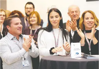  ?? PHOTOS: NICK BRANCACCIO ?? Rob Campana, left, Kirsten Campana and Nancy Campana applaud the announceme­nt of finalists during the 2020 Business Excellence Awards at AGW Wednesday.