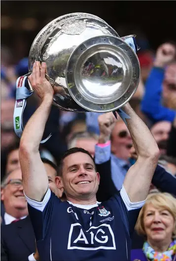  ??  ?? Dublin captain Stephen Cluxton lifts the Sam Maguire Cup.