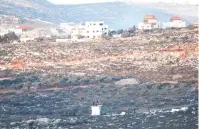  ?? (Nasser Ishtayeh/Flash90) ?? SETTLERS TRY to rebuild the Or Haim illegal outpost, named after late religious-Zionist leader Rabbi Haim Druckman, yesterday.