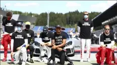  ?? Associated Press ?? A total of 14 drivers took a knee to support Black Lives Matter before Sunday’s F1 race. Six remained standing.