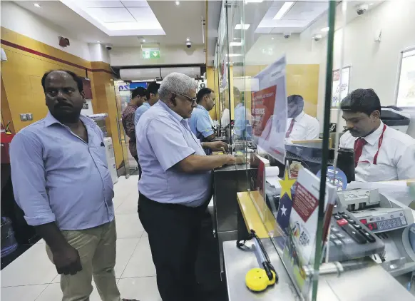  ?? Pawan Singh / The National ?? A UAE Exchange outlet in Dubai. The foreign exchange company was placed under supervisio­n by the UAE Central Bank in March last year