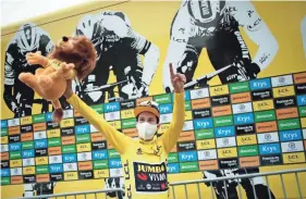  ?? BENOIT TESSIER/POOL VIA AP ?? Slovenia’s Primoz Roglic celebrates Sunday after completing the ninth stage of the Tour de France with finish in Laruns, France.