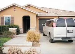  ?? SANDY HUFFAKER / GETTY IMAGES ?? The home where a couple was arrested after police discovered that 13 people had been held captive in filthy conditions with some shackled with chains and padlocks.