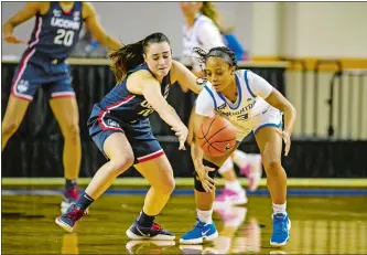  ?? JOHN PETERSON/AP PHOTO ?? UConn guard Nika Muhl (10) knocks the ball away from Creighton guard DeArica Pryor (3) for one of her five steals during the No. 1 Huskies’ 81-49 victory over Thursday in Omaha, Neb.