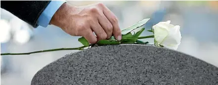  ?? ?? LEFT: Granite is the most popular choice for headstones in New Zealand. Most is imported in several standard shapes. RIGHT: Textured stone may require larger lettering to remain legible with weathering.