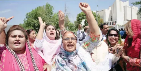 ??  ?? Supporters of Nawaz Sharif chant slogans following the Supreme Court decision to disqualify him from holding office for life, in Islamabad, on Friday. — Reuters