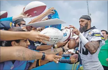  ?? Gina Ferazzi Los Angeles Times ?? CHARGERS receiver Keenan Allen signs autographs in Costa Mesa, where crowds were up from last year.