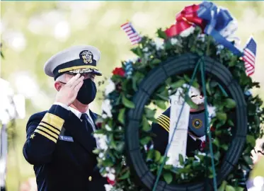  ?? SAM NAVARRO For the Miami Herald ?? U.S. Southern Command commander Navy Adm. Craig Faller salutes after wreaths were presented during a 9/11 Ceremony of Remembranc­e at Tropical Park on Saturday.