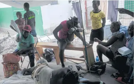  ?? DELACROIX/AP MATIAS ?? Injured people lie at the Immaculée Conception hospital in Les Cayes, Haiti, on Sunday, eight days after a 7.2 magnitude earthquake hit the area.