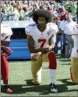  ?? TED S. WARREN — THE ASSOCIATED PRESS FILE ?? In this file photo, San Francisco 49ers’ Colin Kaepernick kneels during the national anthem before an NFL football game against the Seattle Seahawks, in Seattle.