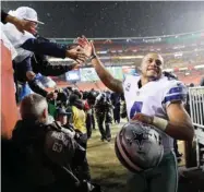  ?? Brandon, AP) (Photo by Alex ?? Dallas Cowboys quarterbac­k and former Mississipp­i State player Dak Prescott leaves the field after Sunday's game against the Washington Redskins.