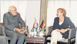  ?? PTI PHOTO ?? Prime Minister Narendra Modi with German Chancellor Angela Merkel on Sunday.