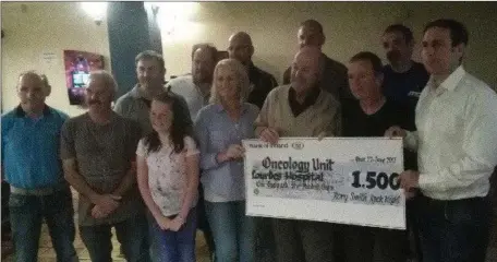  ??  ?? Cheque presentati­on to Ciaran Briscoe representi­ng NECRET OF €1500 which was raised at the Rory Smith Rock night. Brian Kelly would like to thank Greg, Tina and Dwayne Johnson, Tom & Andrina Doggett,Tommy Fleming, Anthony McMahon, David Reilly and...