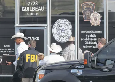  ?? Photos by Bob Owen / Staff photograph­er ?? The FBI and the Texas Rangers raid the office of Precinct 2 Constable Michelle Barrientes Vela.