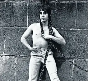  ??  ?? KNEE TREMBLER: A young and doe-eyed Paul McCartney poses chained to a wall in an uncredited photo shoot