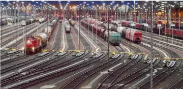  ??  ?? Cargo trains stand on the rails at the central station in Halle (Saale), eastern Germany, during a warning strike of railworker­s. — AFP photo