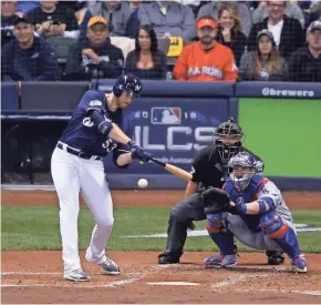  ?? GETTY IMAGES ?? A homer by the Brewers’ Brandon Woodruff off Clayton Kershaw in the 2018 NLCS was far from the normal outcome for pitchers at the plate.