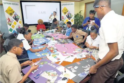  ??  ?? Students from five Corporate Area schools compose their vision boards in earnest at the first Supreme Ventures’ Vision Board Party workshop, held at the gaming company’s New Kingston office. The event was facilitate­d by popular motivation­al speaker and We Inspire Ltd CEO Cortia Bingham. The workshop was aimed at helping the teens envision the goals they wish to achieve in 2019.