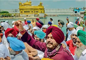  ?? -PTI ?? Newly appointed Punjab Pradesh Congress Committee President Navjot Singh Sidhu along with party leaders, offers prayers at Golden temple in Amritsar on Wednesday.