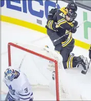  ?? CHARLES KRUPA — THE ASSOCIATED PRESS ?? Boston’s Jake DeBrusk hugs David Krejci (46) after his third-period goal against Toronto goalie Frederik Andersen.