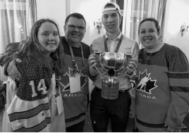  ??  ?? Gold medal happiness! Jordan, left, Jamie, Jared and Sandra Mcisaac enjoy the moment following Canada’s world junior hockey victory.