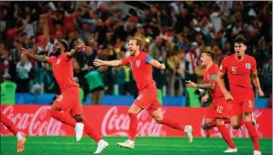  ??  ?? English players celebratin­g having beaten Colombia in penalties.