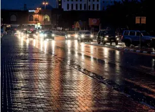  ??  ?? Sporadic rain hit several places in Dubai, including Discovery Gardens. —Photo by Neeraj Muralli