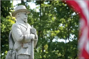  ?? Photo by Ben Goff ?? A Confederat­e monument of James H. Berry stands on the Bentonvill­e square.