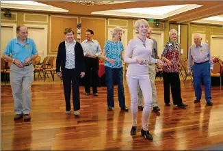  ?? CONTRIBUTE­D BY RANDY SCHIFF ?? Instructor Lyn Riddle (front) leads a group of die-hard ballroom dancers in a line dance of the rumba. The dancers are (from left) Tom Davis, Cecile Hooks, Camille Davis, Darrol Fry, Dorothy Jones and Scott James. A second instructor, Joe Locurto, is...