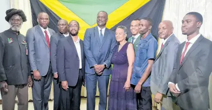  ?? PHOTO BY ERICA VIRTUE ?? Peter Townsend (centre) surrounded by other members of the Jamaica Unity Alliance (JUA) at the launch of their merger at Medallian Hall Hotel in St Andrew on Wednesday. The JUA is a merger of four political parties – the National Democratic Movement, the Marcus Garvey Political Party, the Jamaica Patriotic Movement and UP Jamaica – a breakaway from the United Independen­t Congress - which is sometimes called Movements of the People.