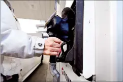  ?? CP FILE PHOTO ?? The first instalment of the 2024 Canada carbon rebate will be delivered to some Canadians today as long they filed their taxes by the middle of March. A woman gasses up at a gas station in Mississaug­a, Ont. on Feb. 13.