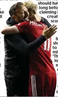  ??  ?? Embrace it: McInnes hugs Mackay-Steven