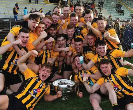  ??  ?? The St Peter’s Dunboyne team celebrate with the Keegan Cup after during the Meath Senior Football Championsh­ip Final victory over Summerhill at Páirc Tailteann.