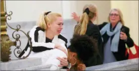  ?? MARK MAKELA/POOL PHOTO VIA AP ?? Bill Cosby accusers, from left, Caroline Heldman, Lili Bernard and Victoria Valentino, right, react outside the courtroom after Cosby was found guilty in his sexual assault retrial, Thursday, April, 26, 2018, at the Montgomery County Courthouse in...