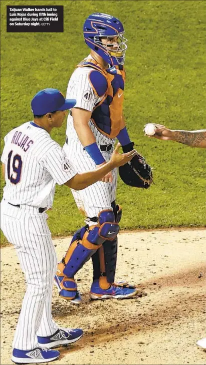  ?? GETTY ?? Taijuan Walker hands ball to Luis Rojas during fifth inning against Blue Jays at Citi Field on Saturday night.