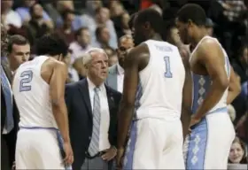  ?? JULIE JACOBSON — THE ASSOCIATED PRESS ?? North Carolina head coach Roy Williams talks to players during a timeout in the second half of an NCAA college basketball game against the Duke during the semifinals of the Atlantic Coast Conference tournament, Friday in New York. Duke won 93-83.